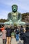 A monumental outdoor bronze statue of AmitÄbha Buddha at the KÅtoku-in Temple - The Great Buddha of Kamakura, front view and tou